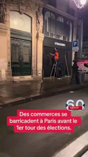 Paris, Rue de Rivoli. Die Ladenbesitzer bereiten sich auf die Verkündung der Erg...
